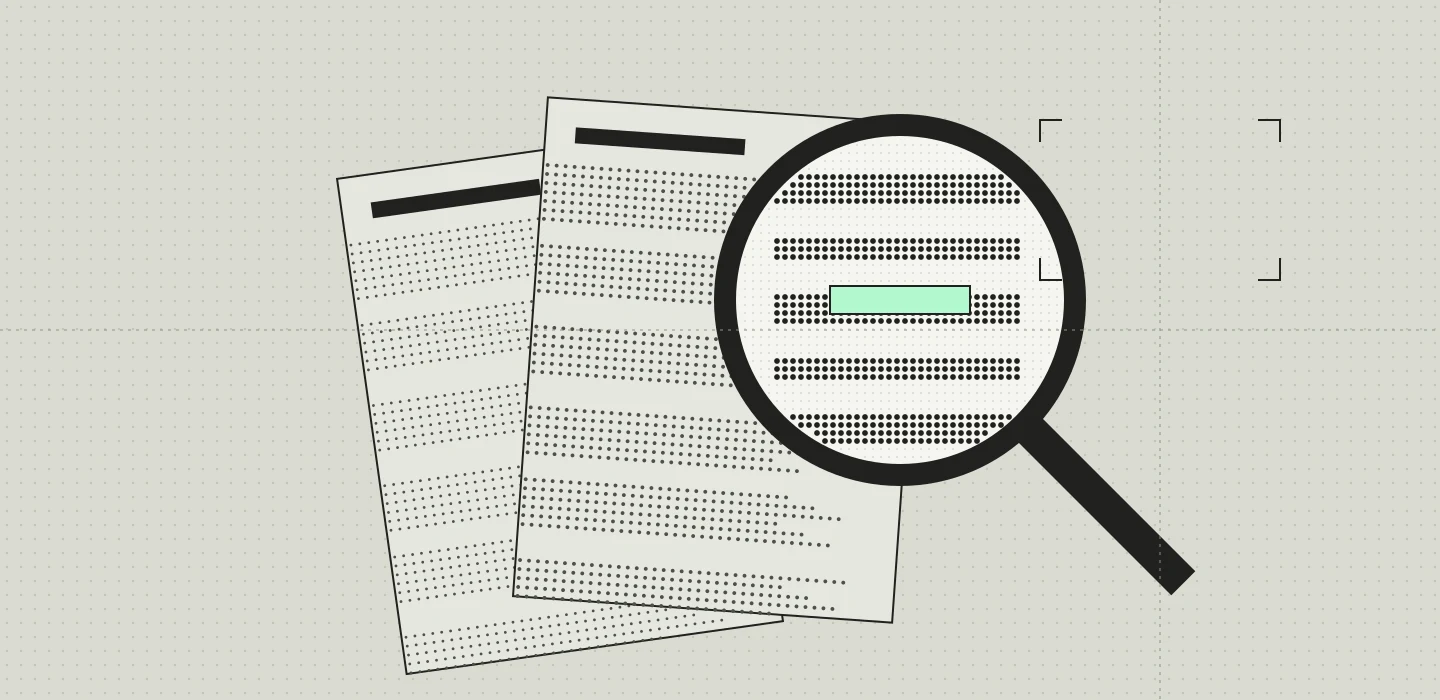 A magnifying lens over two pages of notes, one line highlighted in mint